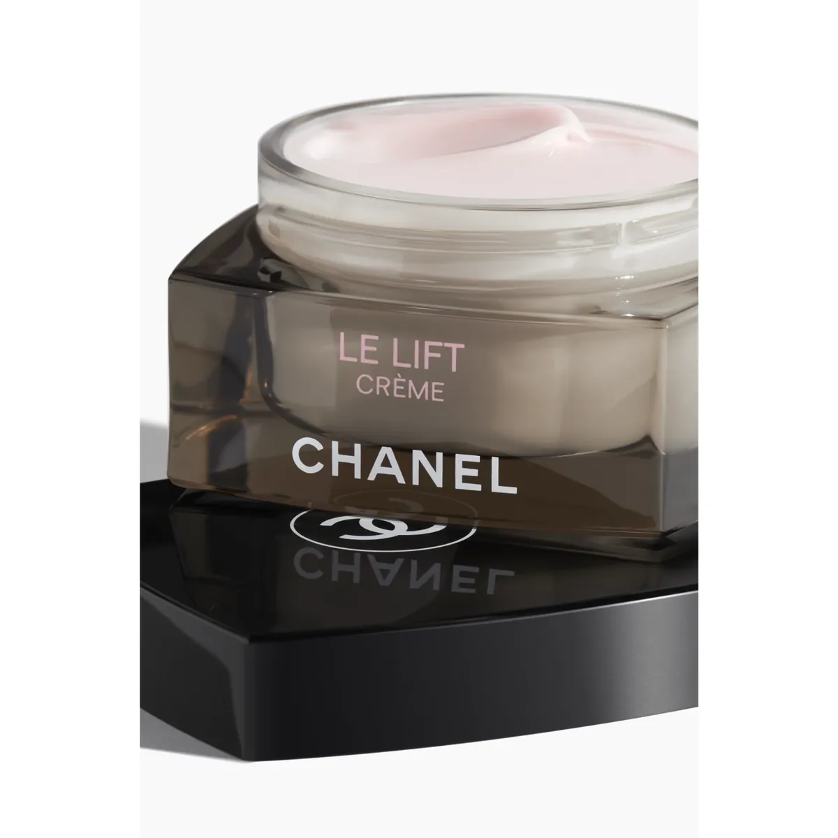 Sample photo for cosmetics: a jar of Chanel Le Lift Crème on a black base
