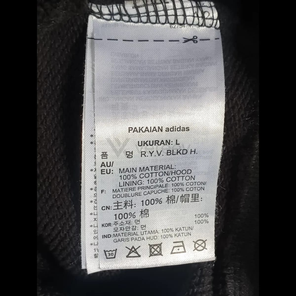 Sample photo 5, Size / Code Tag: a care label listing size L, the fabric and wash symbols